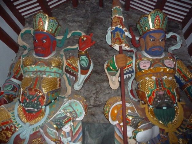Colorful statues on the sides of the steps to the Guanyin temple
