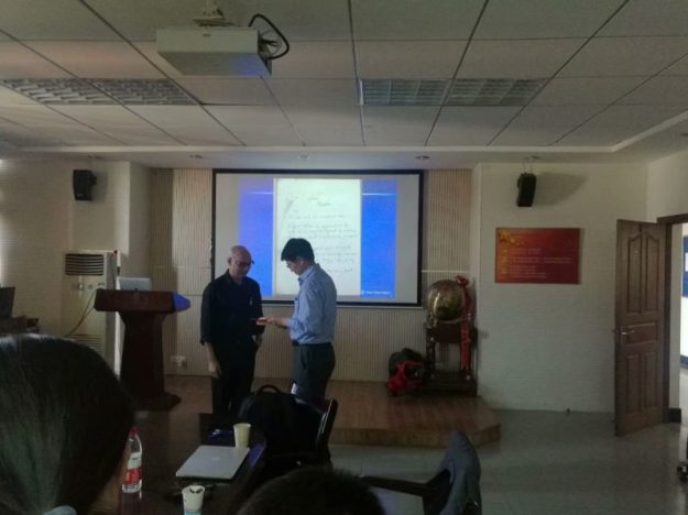 Presenting a book to the Wenzhou University library