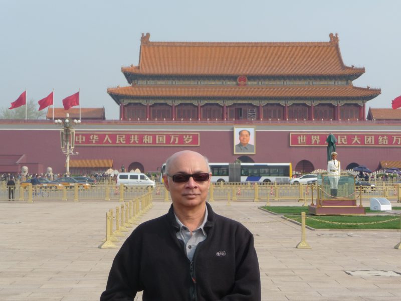 In Tiananmen Square under Mao's portrait, Beijing