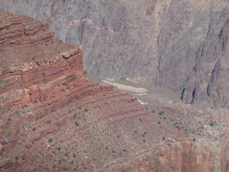 The thin stream of the Colorado river, a mile down from the South Rim.