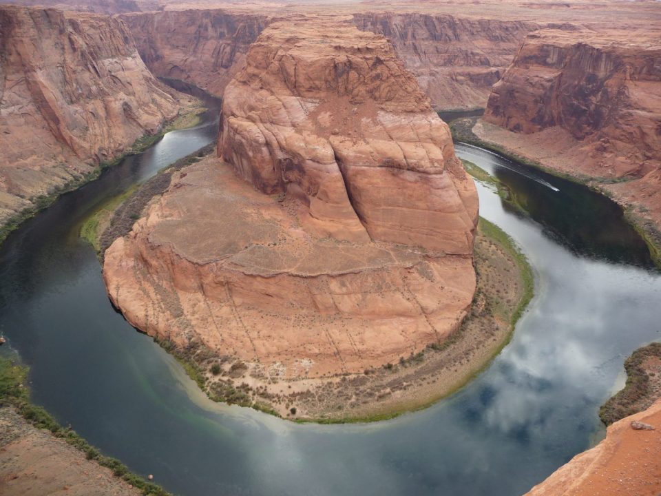 Horseshoe Bend, Arizona. Note the low water level with ridges in the middle of the river.