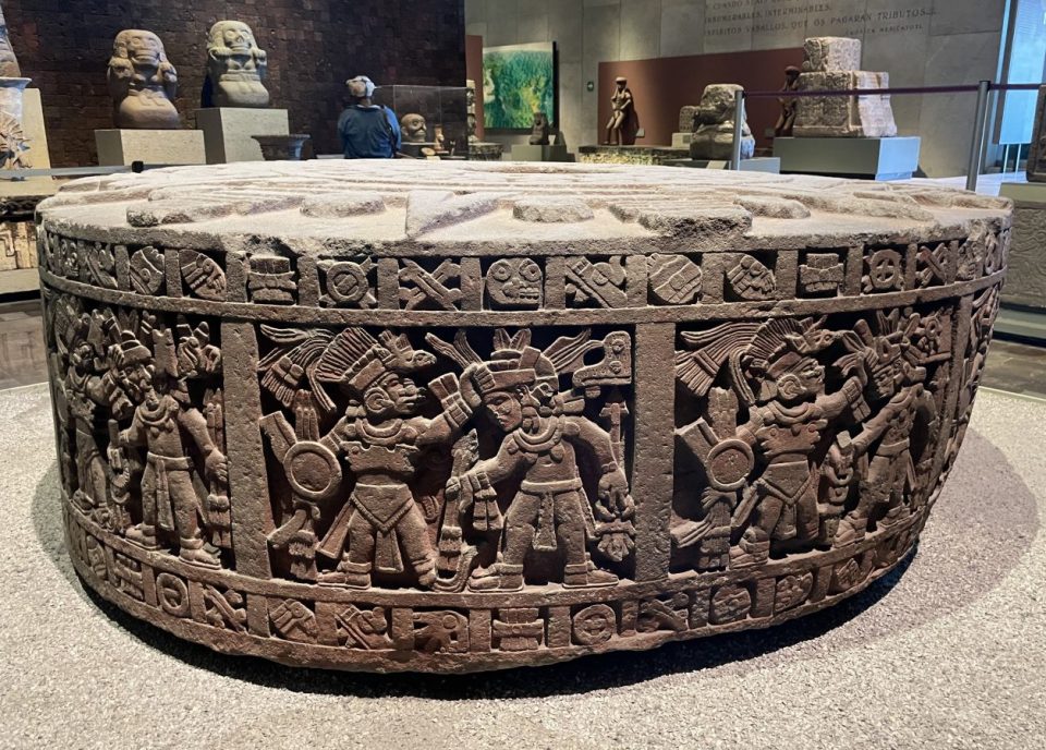 Carving of warriors in battle.