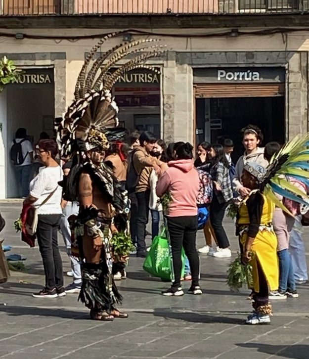 Aztec dancers in elaborate headdresses and leggings, Zocalo, Mexico City.
