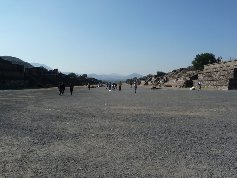 Looking south down the Avenue of the Dead with the ruins of palaces and temples on either side and the mountains in the background, Teotihuacán, Mexico.