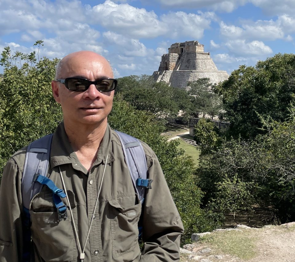 In Uxmal with the Great Pyramid in the background.