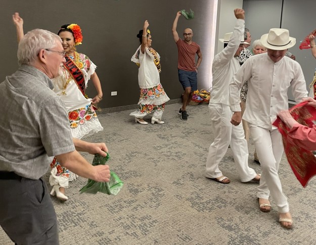 Members of our tour dancing with the Baile Folklorico dancers.