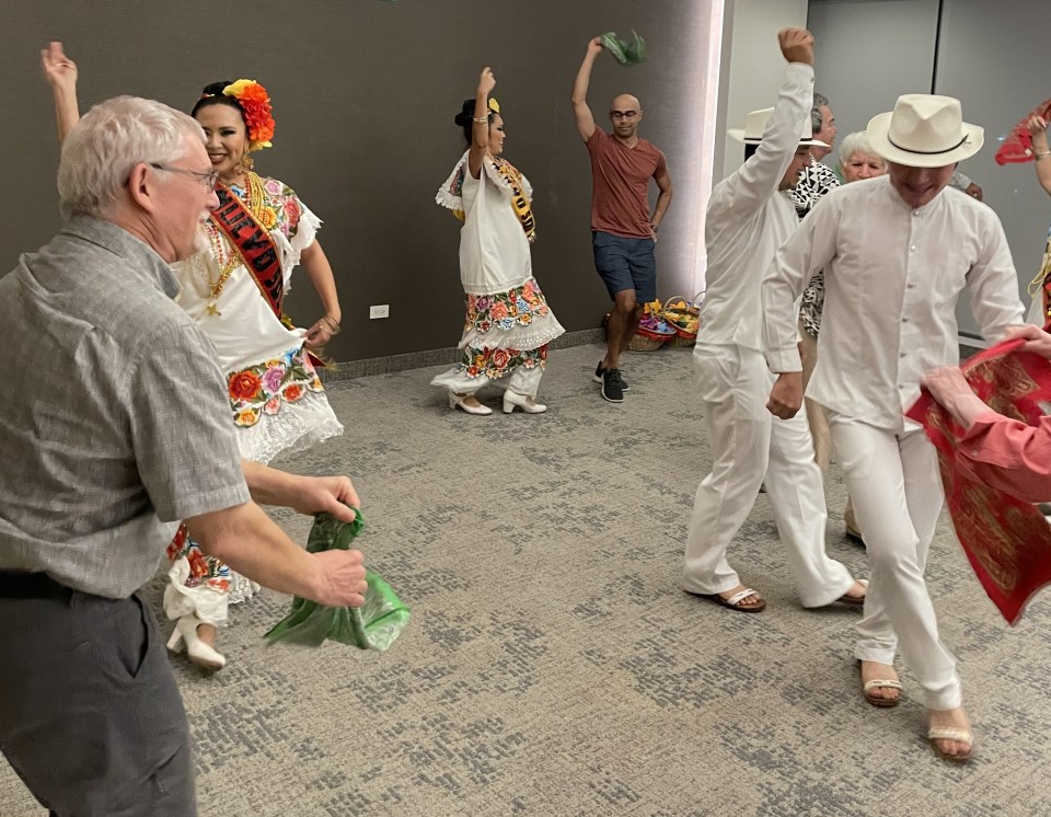 Members of our tour dancing with the Baile Folklorico dancers.