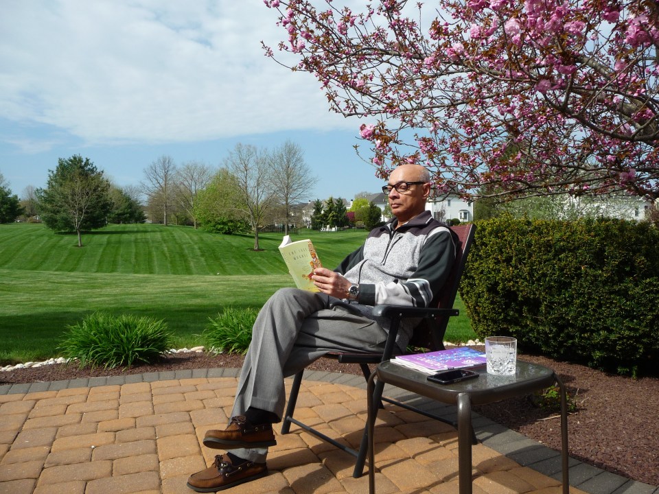 On my patio with a book and a drink.