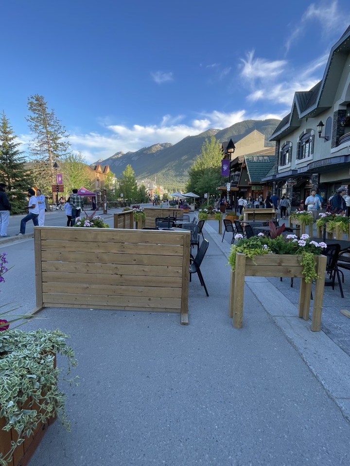 Banff Avenue during tourist season. Car are blocked off making for a very pleasant setting.
