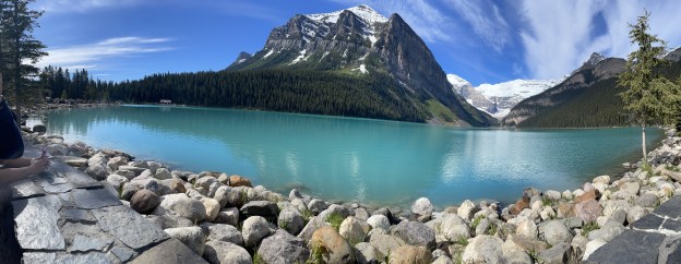 The blue of Lake Louise and snow.covered Mount Victoria.