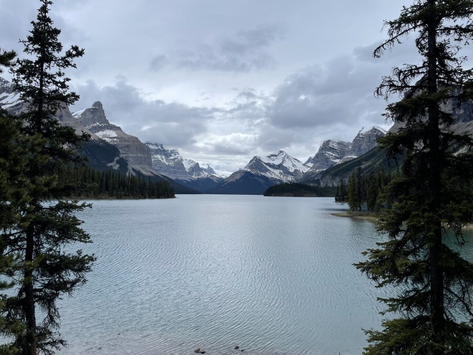 Hall of the Gods, under cloudy skies in Maligne Lake, Canada.
