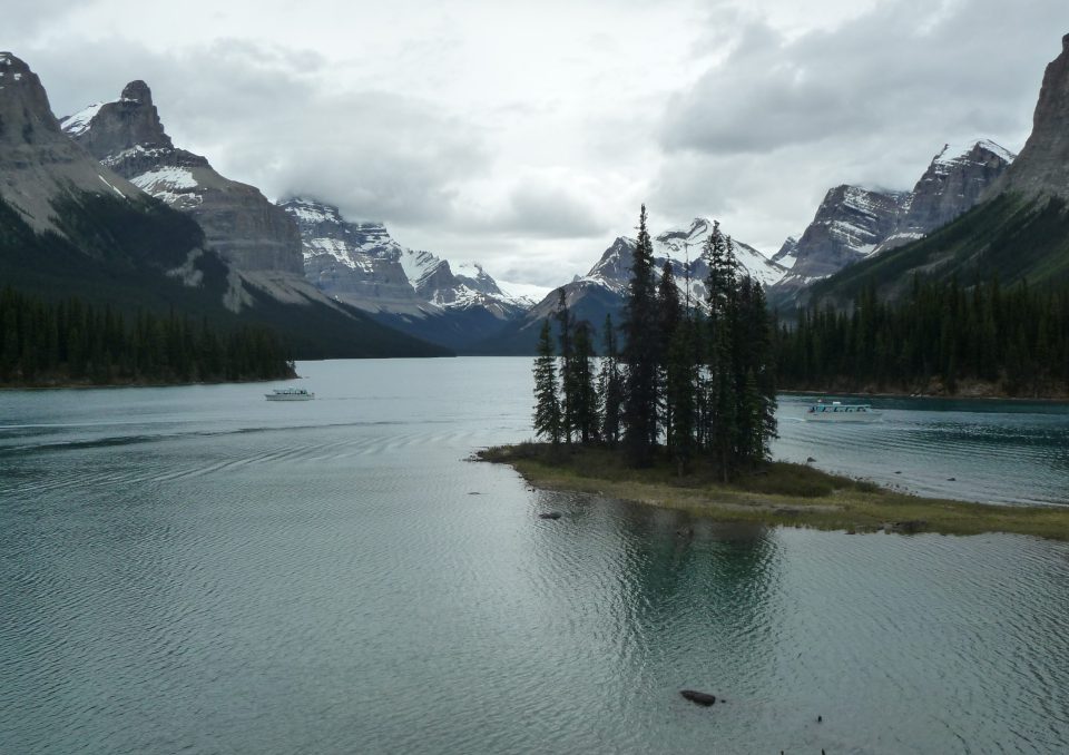 Spirit Island and Maligne Lake under cloudy skies, Jasper National Park, Canada.