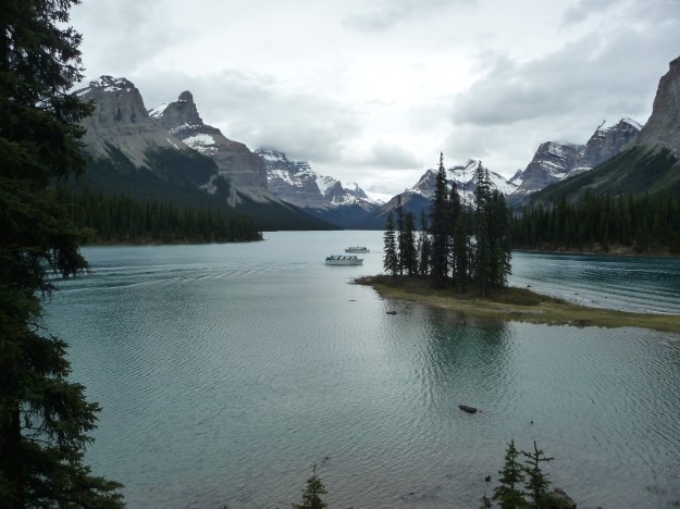 Spirit Island and Maligne Lake, seen under cloudy skies, Jasper National Park, Canada.