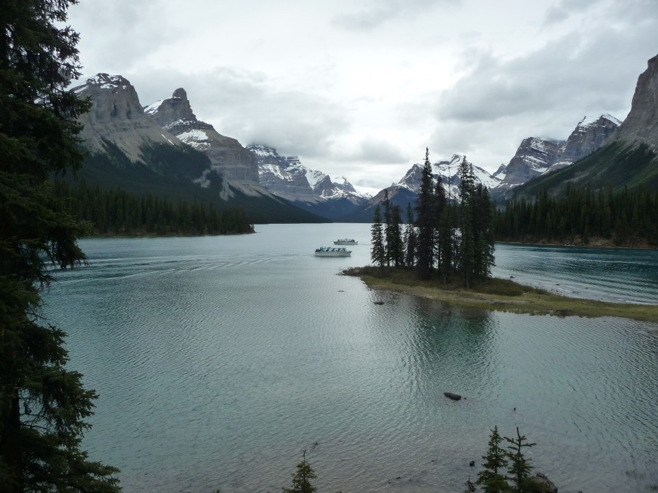 Spirit Island and Maligne Lake, seen under cloudy skies, Jasper National Park, Canada.