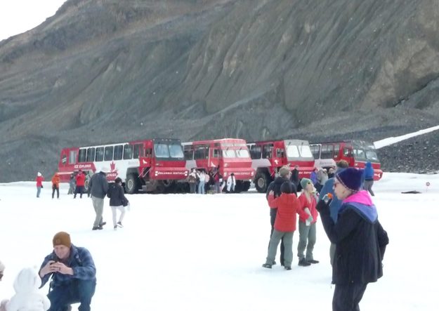 Visitors to the glacier with the Ice Explorers in the background. Note the snowman on the lower left.